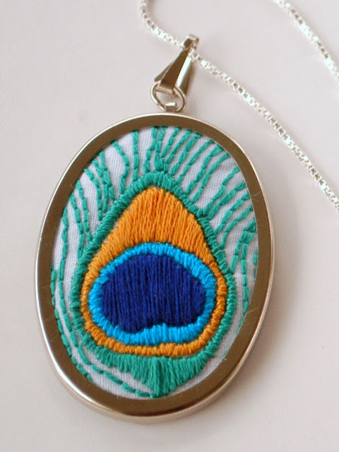 Hand embroidered feather pendant