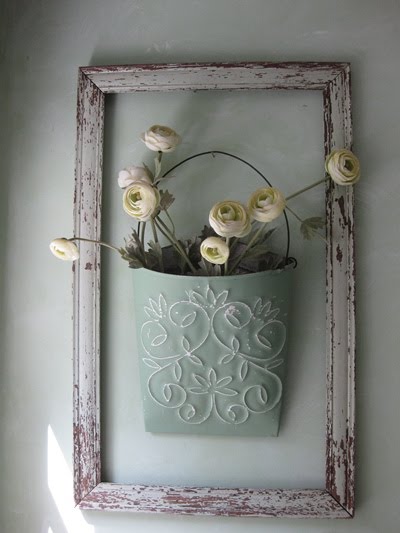 Worn frame and tin flower hanger