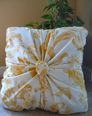 Gathered pillow with a button centre