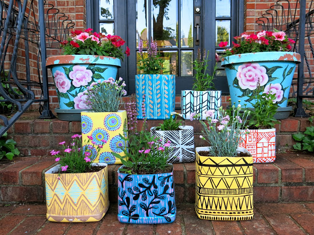 Painted kitty litter planters 15 Neat Ways to Repurpose Kitty Litter Containers