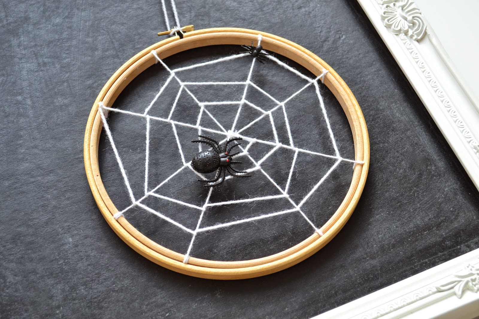diy spiderweb hoops 50 SPOOKtacular DIY Halloween Decorations For the House and the Party