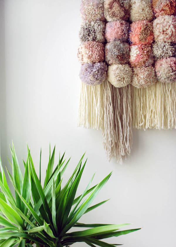 Giant multicolor pom pom wall hanging