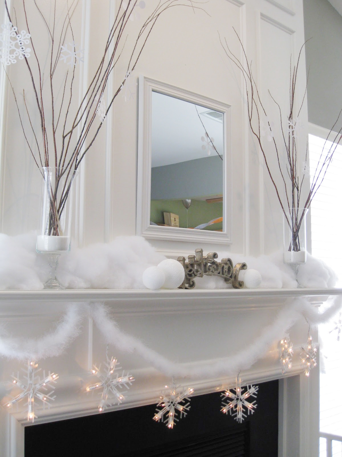 Snow and twig mantel decor