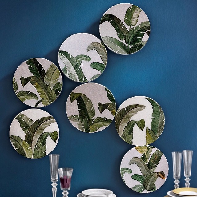 Dishes with leaves on wall