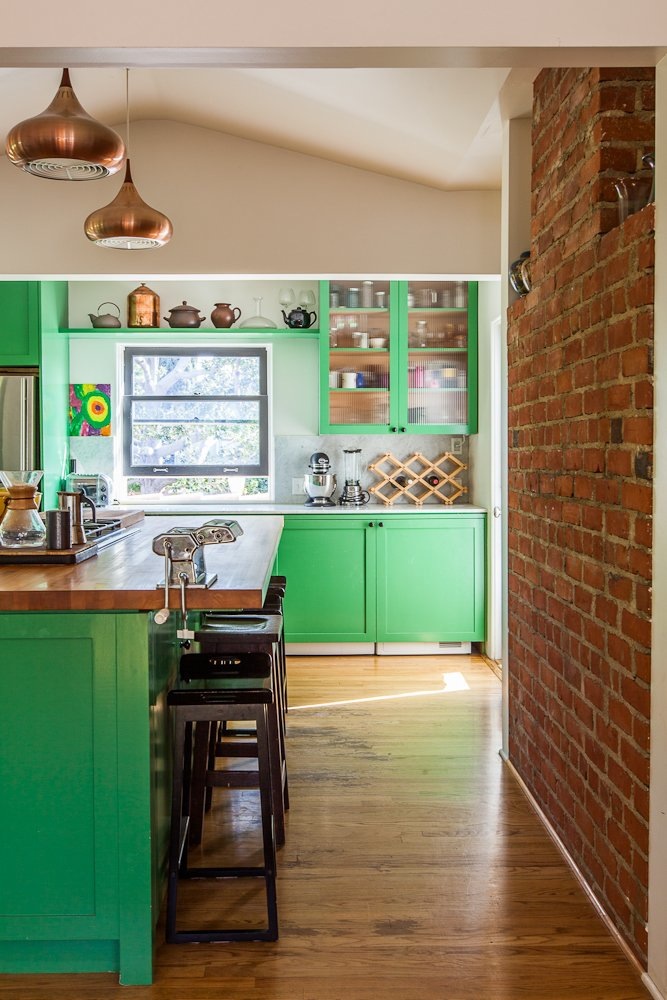 Green and brick kitchen