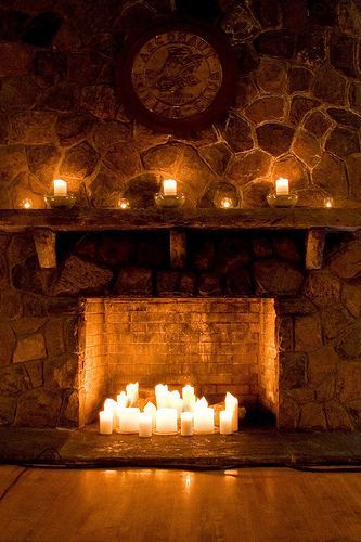 Candles inside fireplace design idea