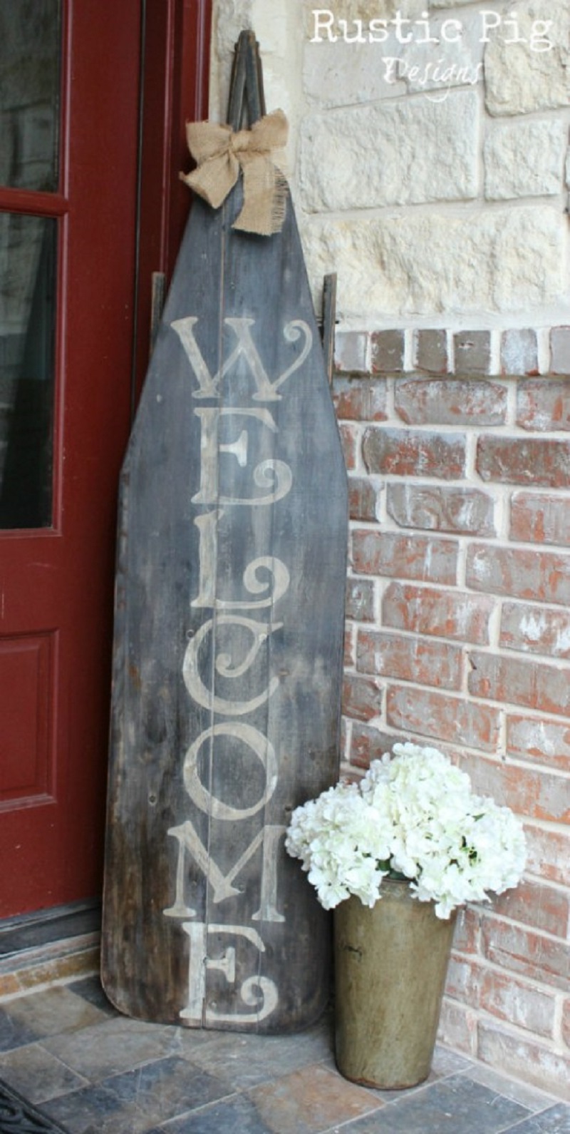 Old wooden ironing board welcome sign