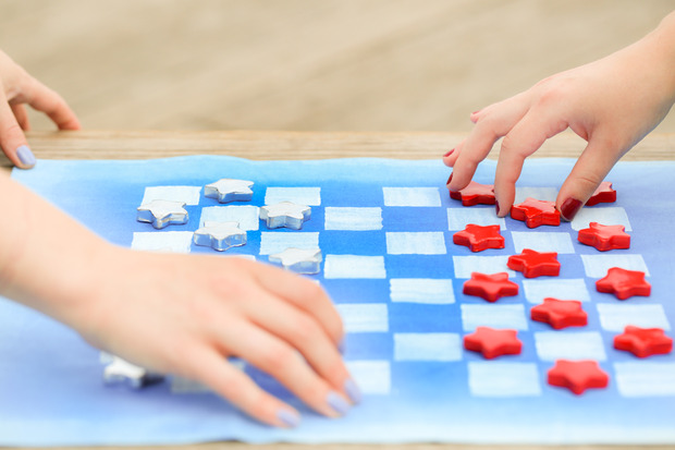 Red white and blue checkers travel game
