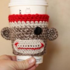 Crocheted sock monkey cozy