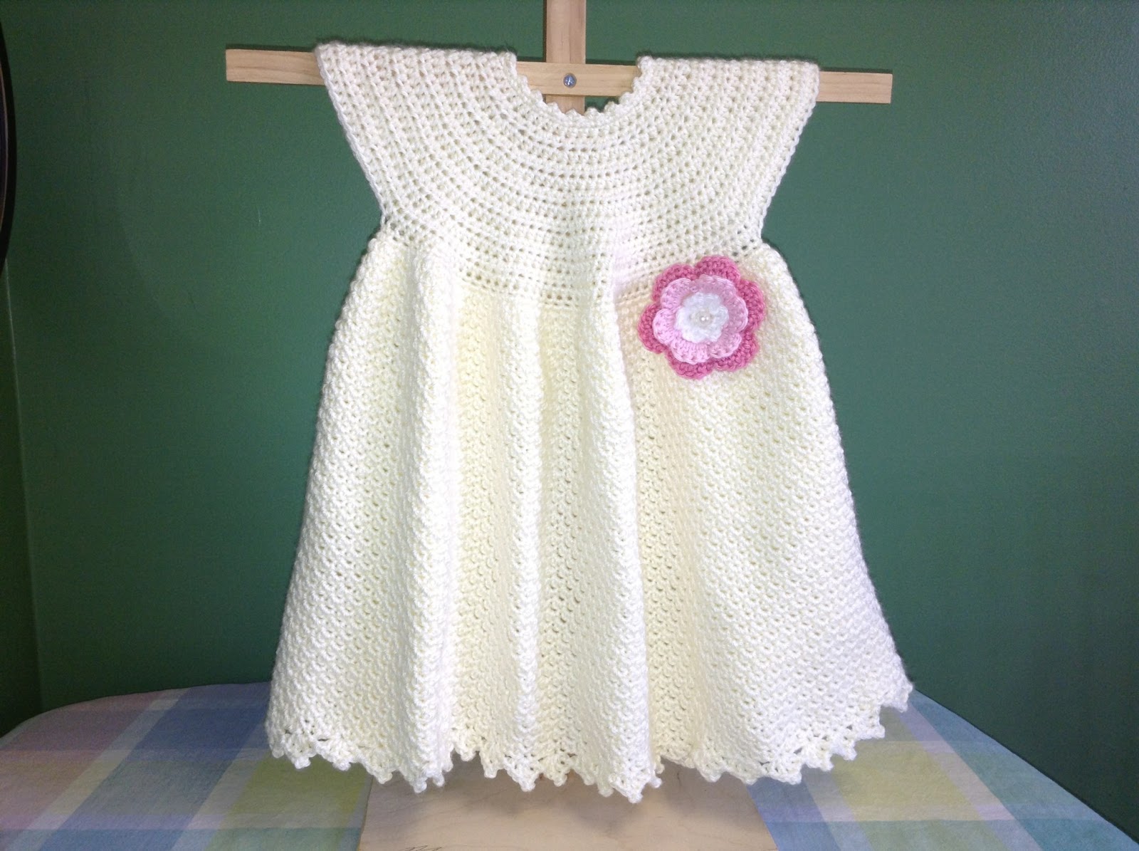 Pretty baby dress with crocheted rosette