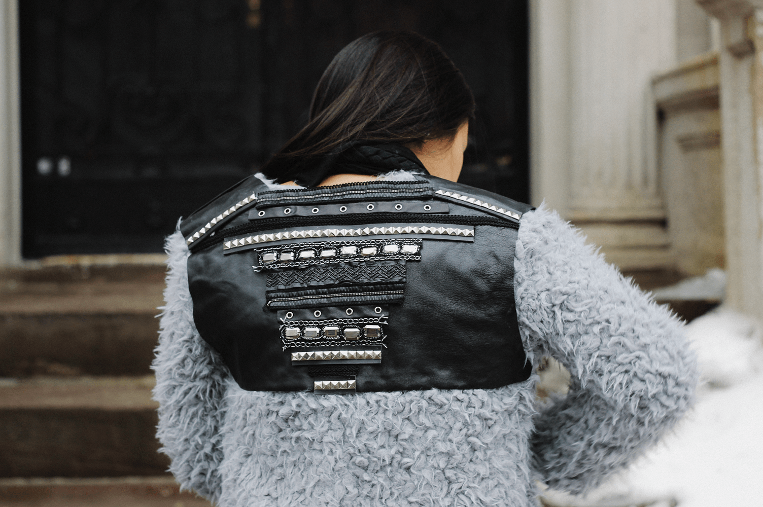 Faux fur and studded leather jacket