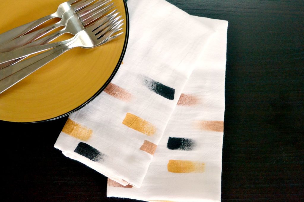 Setting table with brush stroke napkins
