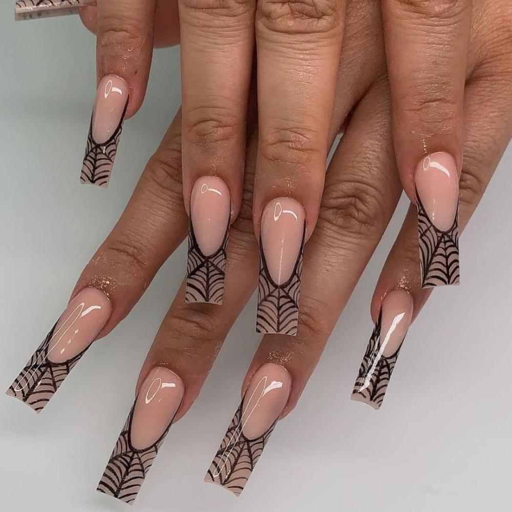 Black and nude spiderweb acrylic nails for halloween