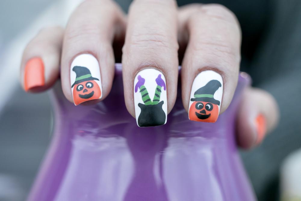 Pumpkin and witch legs nail art design