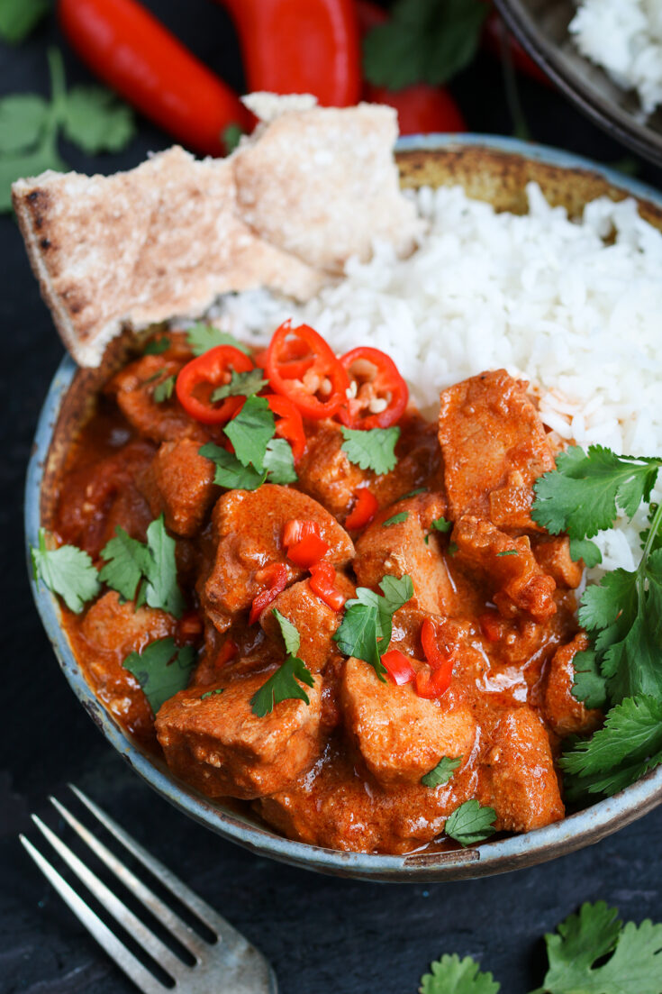 An easy from-scratch crockpot chicken curry with a kick of chili spice.