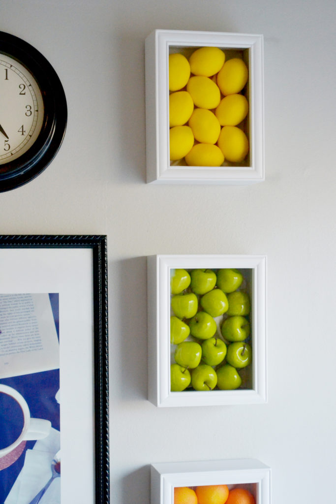 Wall art with large fake fruits