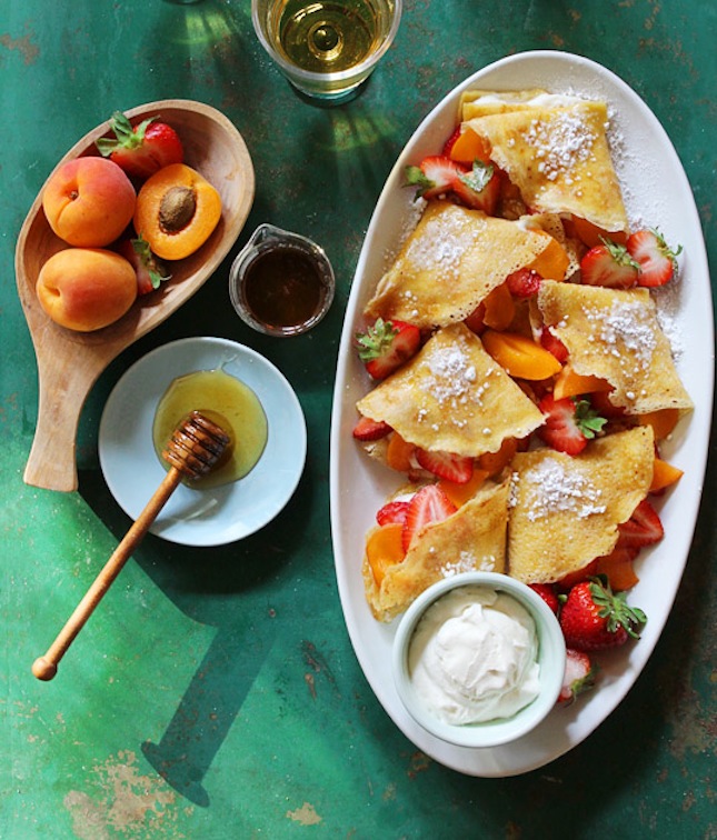 Hazelnut crepes with honey whipped cream and fruit