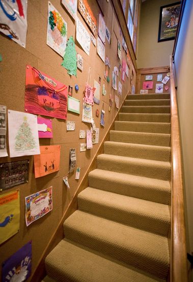 Cork board wall by the stairs