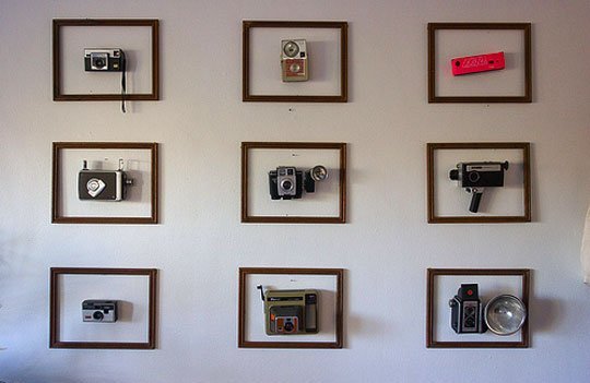 Framed vintage cameras