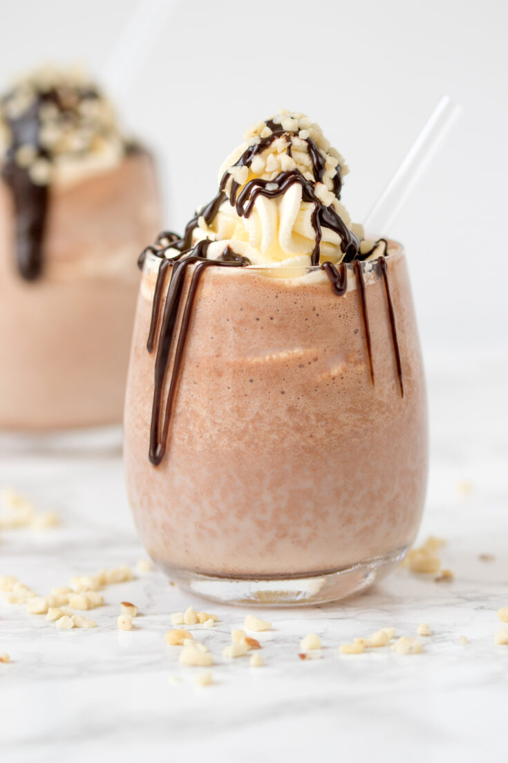 5 Minute chocolate peanut butter smoothie with whipped cream and chocolate sauce. So delicious!!