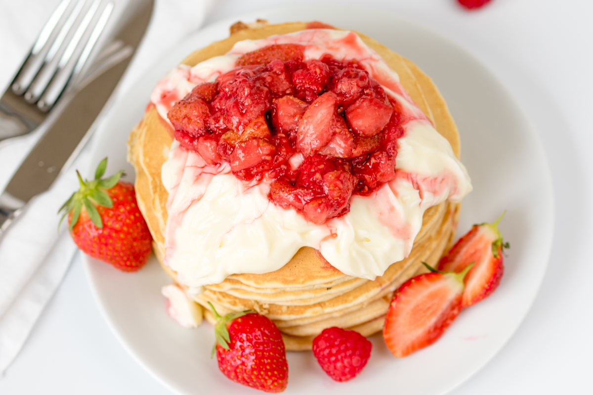 Fluffy pancakes with a simple cheesecake and strawberry compote topping!