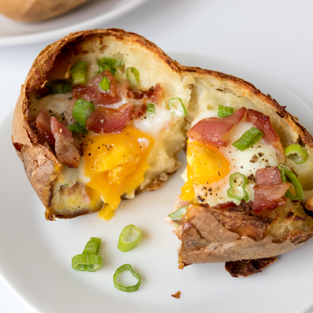 Baked egg breakfast boats with bacon and scallions finished square