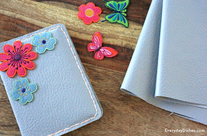 Faux leather cover with embroidered flowers