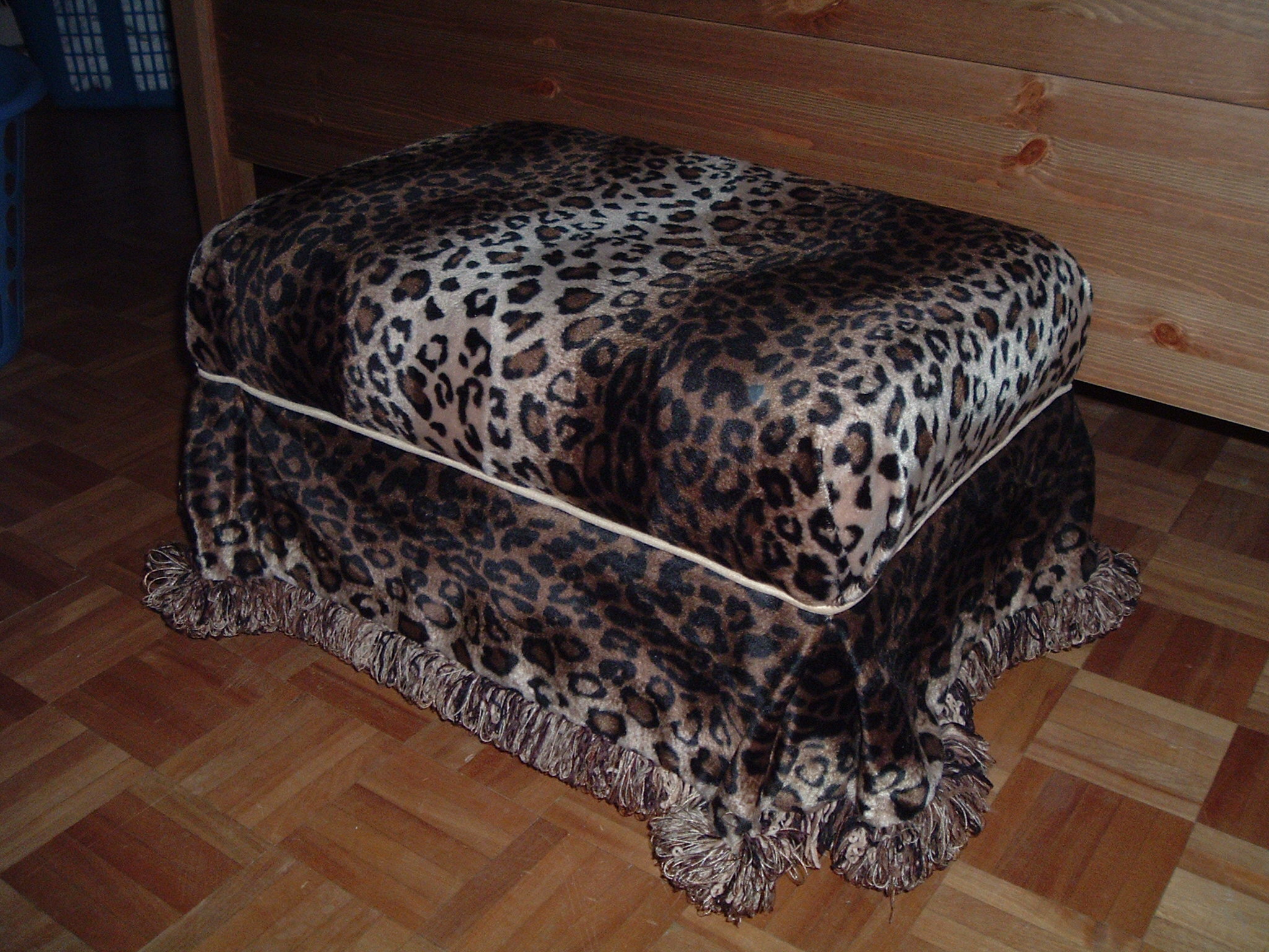 Leopard print covered ottoman