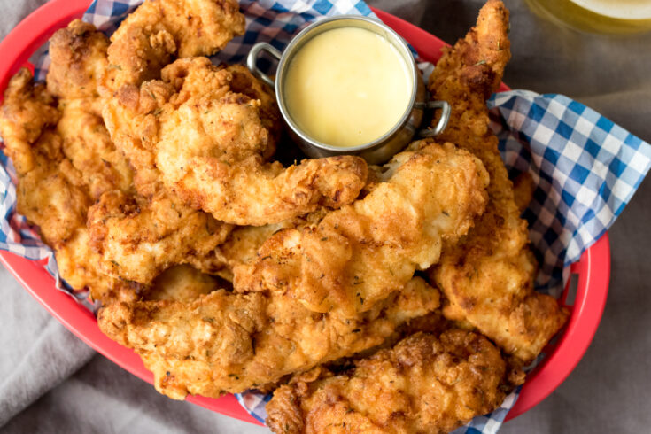 Juicy chicken tenders with a delicious crispy coating - serve with this sweet honey mustard dip for a seriously addicting treat!