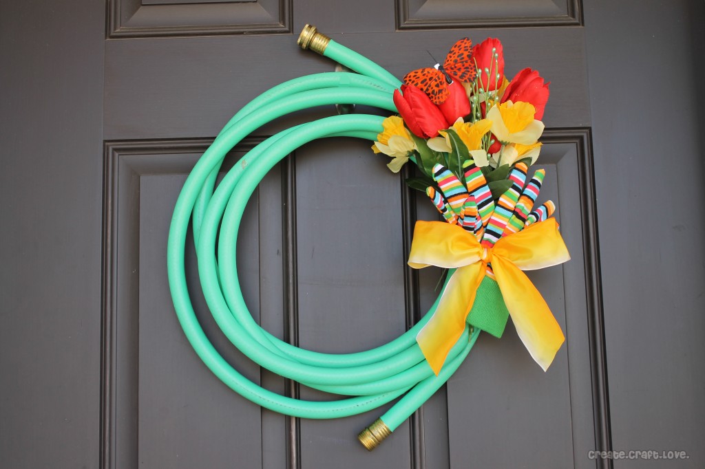 Garden hose and flower door wreath