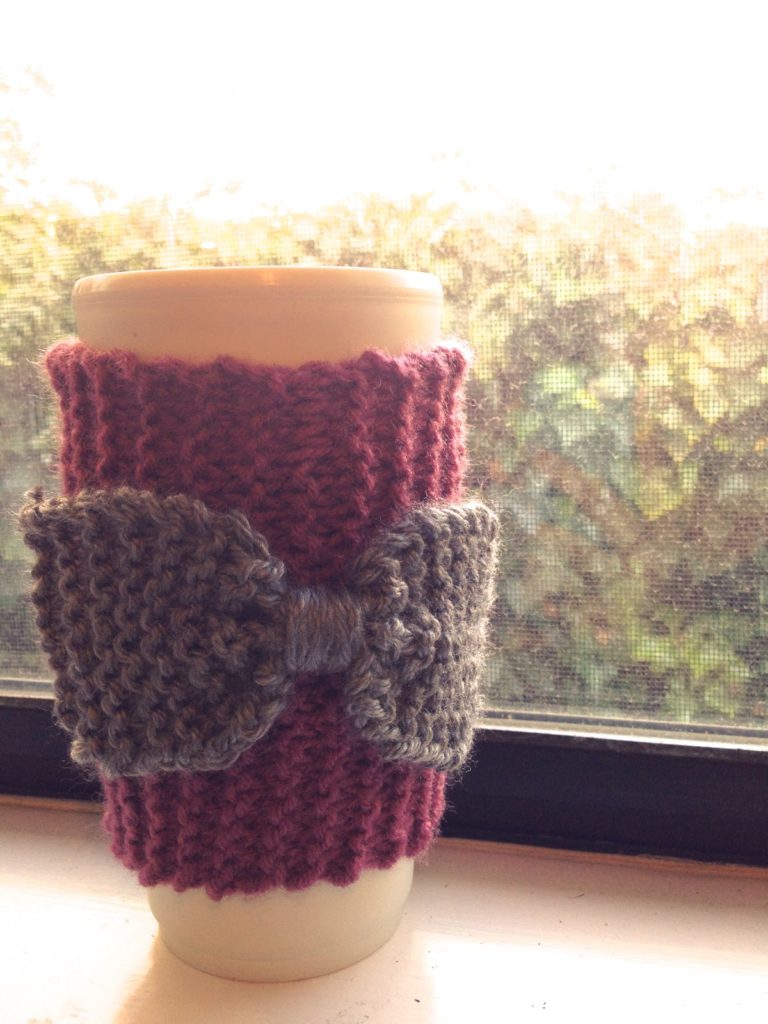 Knitted bow coffee sleeve