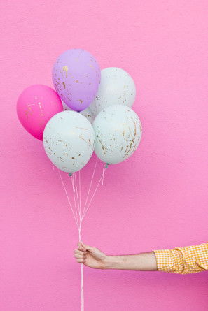 Pastel and gold paint splattered balloons