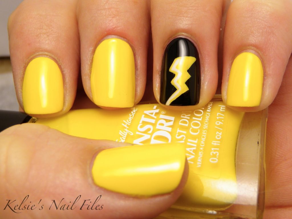 Yellow nails with a lightning bolt accent