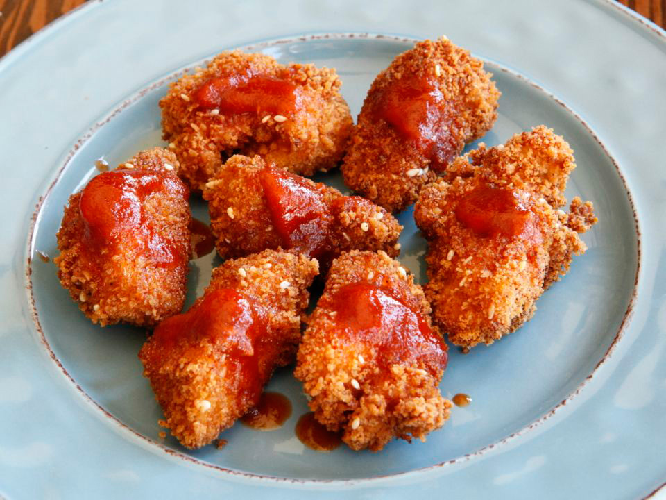 Smoky panko schnitzel bites with honey sriracha sauce