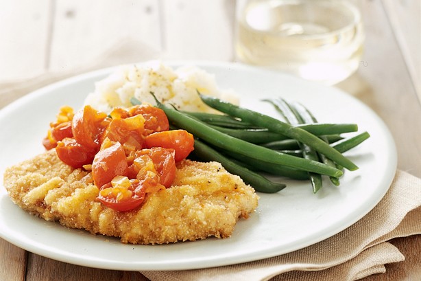 Vienna schnitzel with cherry tomato sauce