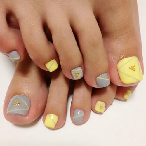 Soft yellow and gray pedicure