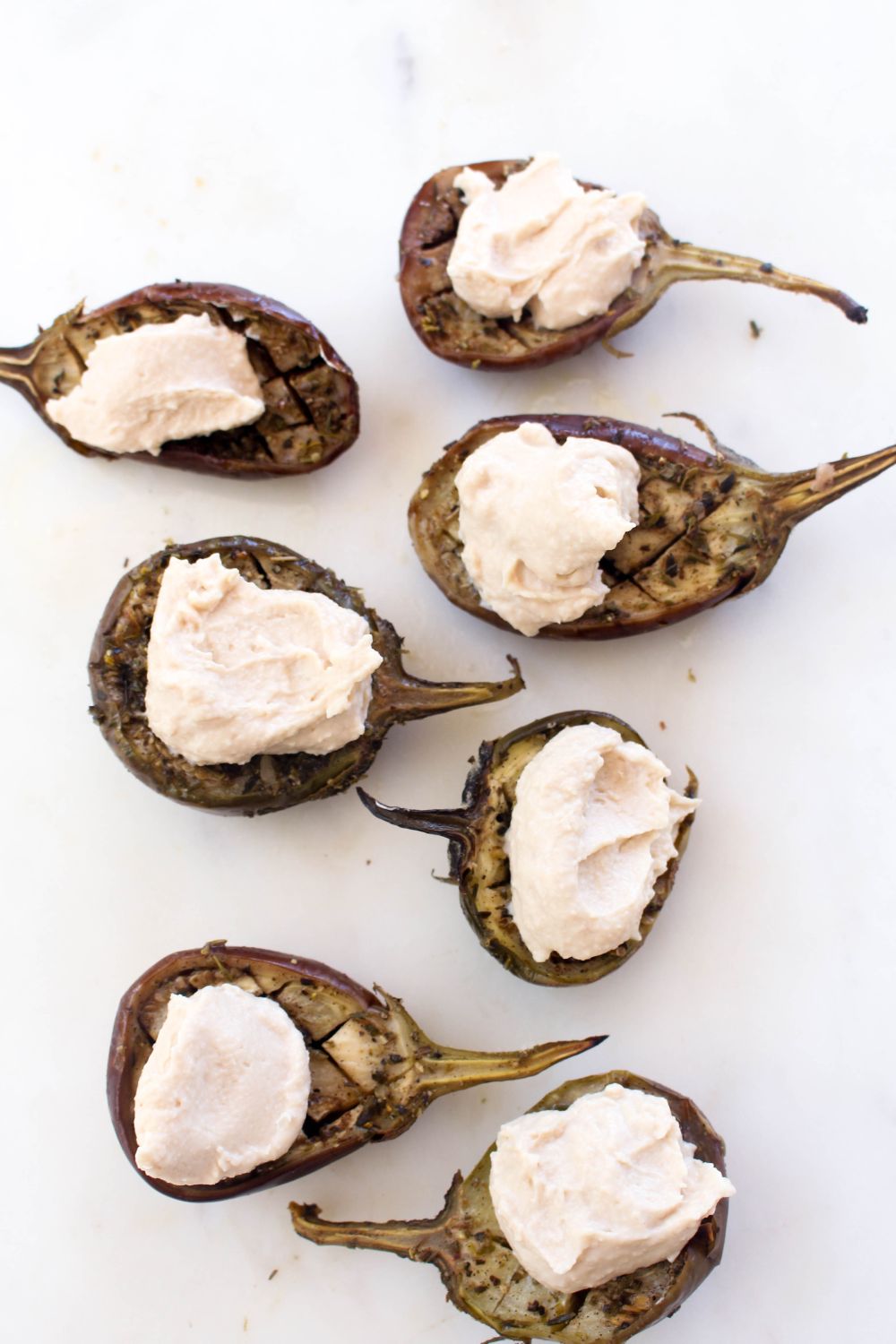 Slow roasted eggplant with hummus and tomato jam top with humus