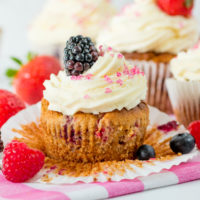 Gluten Free Berry Cream Cupcakes - Light and fluffy cupcakes, packed with fresh berries and topped with cheesecake cream!