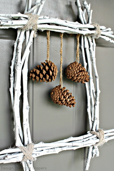 Painted twig and pine cone wall decor