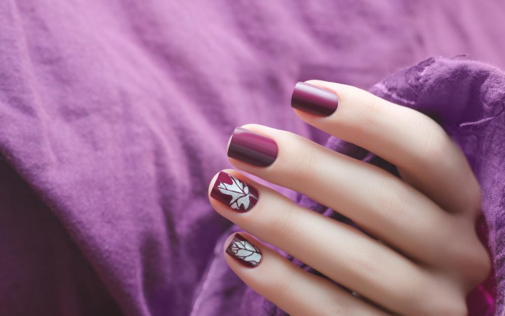 Dark purple nails with white maple leaf november nails