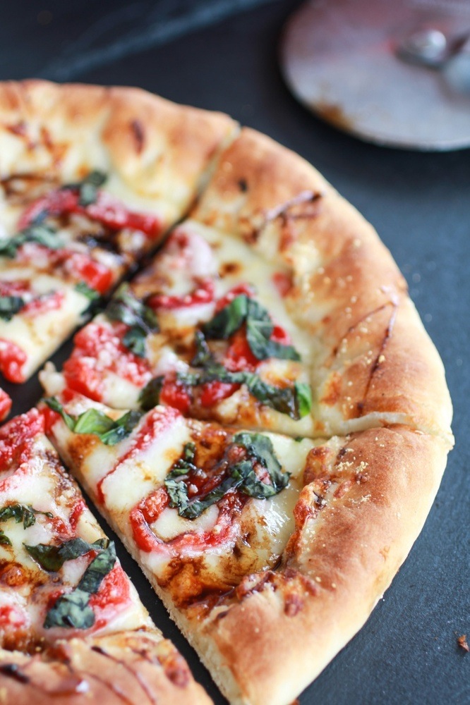 Green olive pasto pizza with roasted red peppers and feta stuffed crust