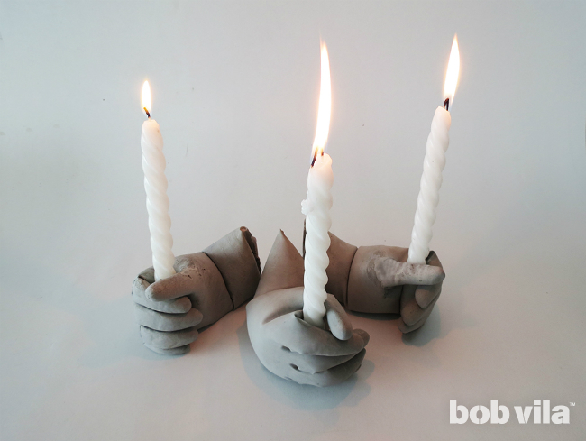 Genius hand shaped candle holders