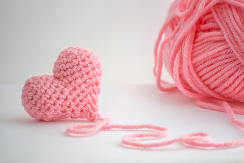 Hand Knitted Super Soft pom-pom Yarn Heart shaped Cushion Ideal Valentines gift. 