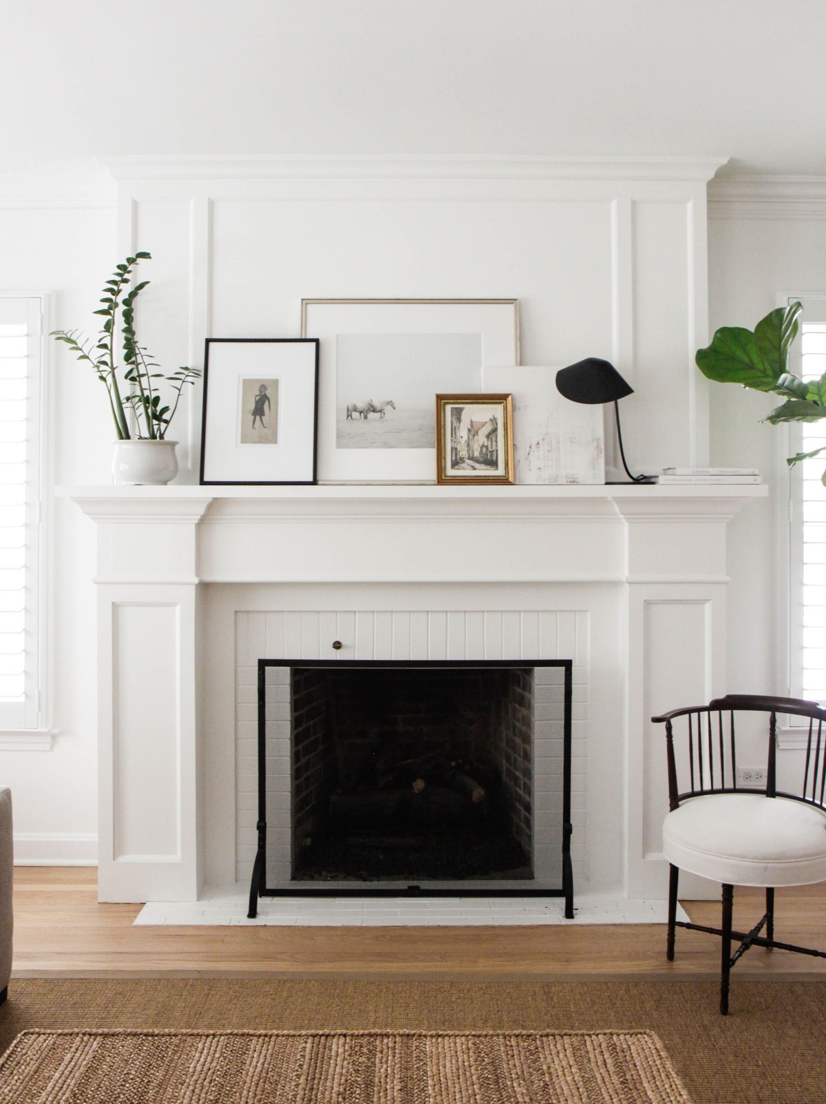 Delicate frames on mantle fireplace design idea