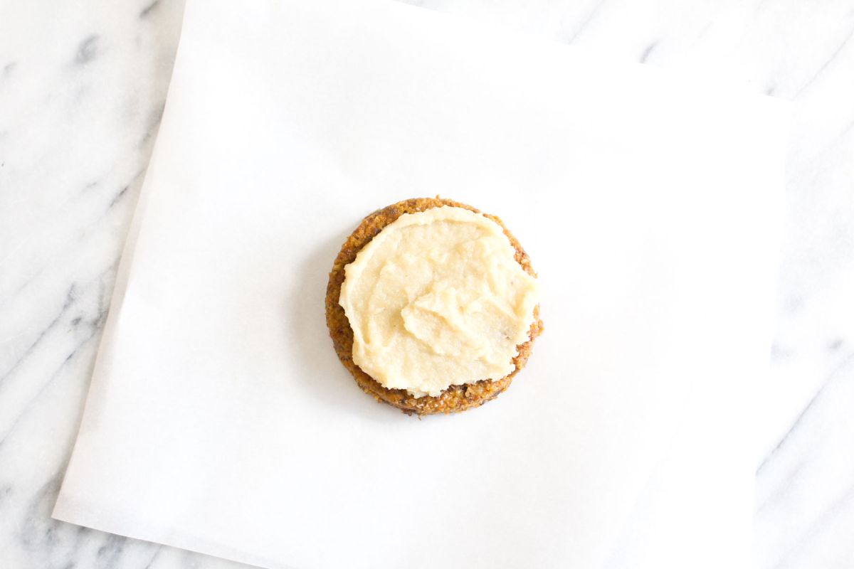Raw carrot cakes with cashew cream cheese frosting frost the top