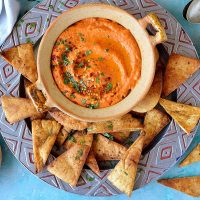 Roasted red pepper and chilli hummus with home-made pitta chips - quick and easy to make and an ideal snack!
