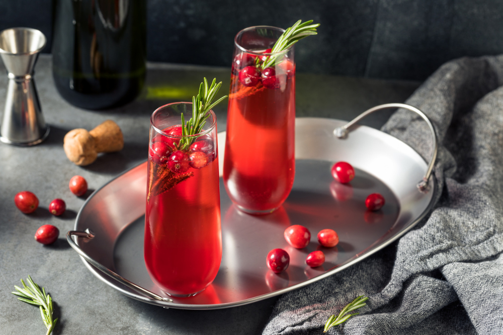 Cranberry Champagne Poinsettia Cocktail with Rosemary - Flower Drinks