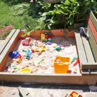 Diy sand box with bench cover