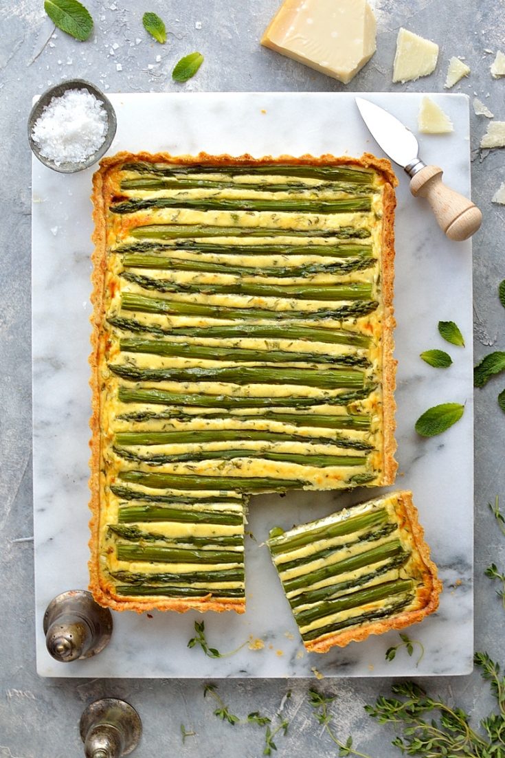 Spring vegetable and feta cheese tart - a stunning vegetarian tart made with asparagus, peas, scallions, feta cheese and parmesan pastry.