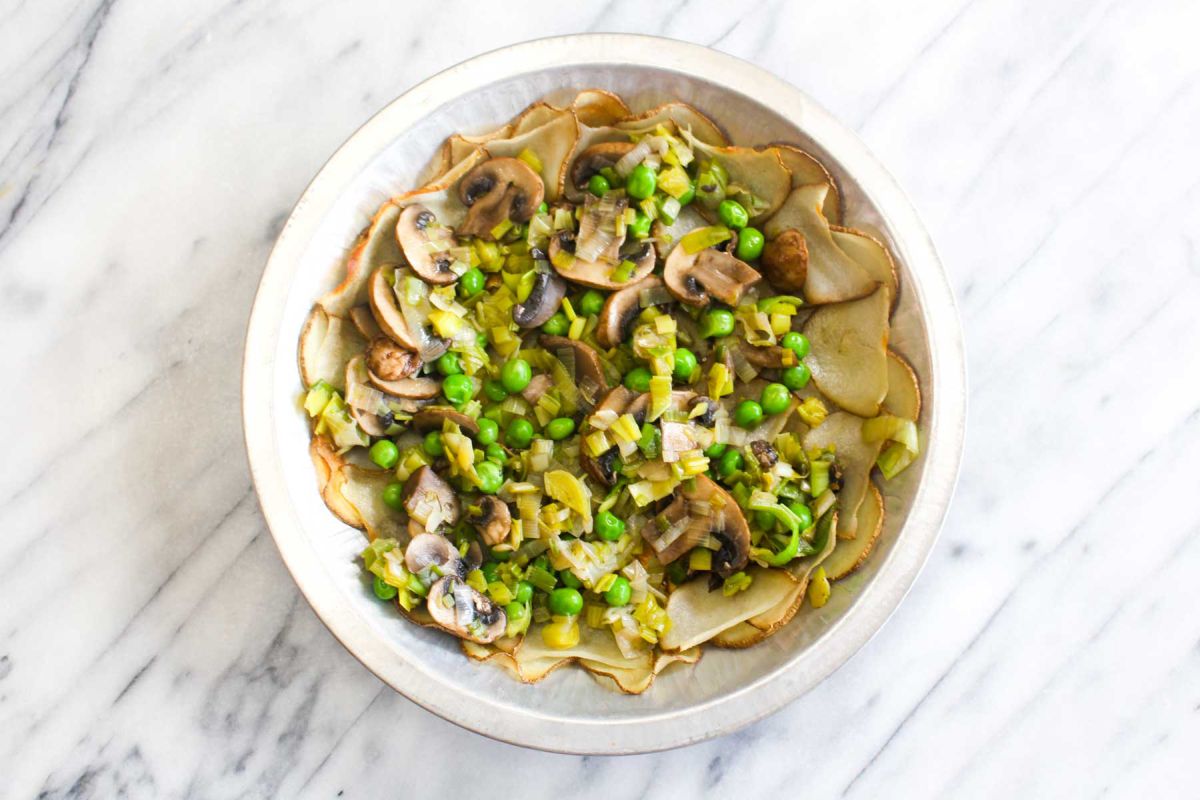 Vegan mushroom and leek quiche stir in the frozen peas